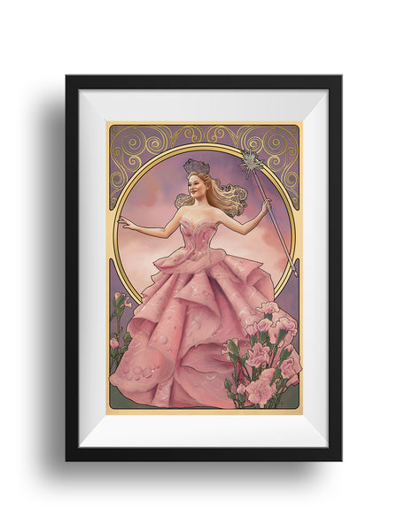 A framed image of Glinda from Wicked, in her pink bubble gown. Her arms are stretched out to either side, her right hand held up delicately, her left holding her wand. Near the bottom of the gown on both sides are pink carnations. Behind her is a circular frame with a pink sunset, and above, the same swirling pattern as Elphaba's piece.