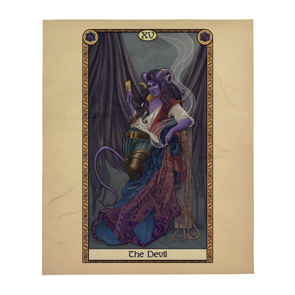 A blanket featuring art from The Devil card of the Tabletop Tarot. A horned figure stands leaning on a stone column with chains hanging from it, and an ornate coat draped over it. In one hand, the figure holds a cigarette with smoke rising. In the other hand is a card between his fingers. In the background, tattered drapes hang, like tattered wings.