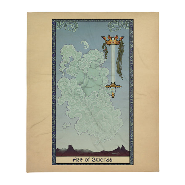 A blanket featuring art of the Ace of Swords from the Tabletop Tarot deck. A wind elemental holds a sword tip up, a crown and laurel leaves falling down around the blade. A decorative border surrounds the art with the words "Ace of Swords" at the bottom.