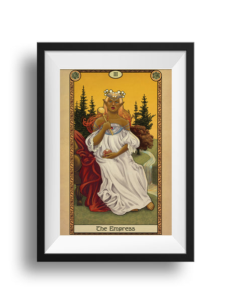 A framed print of a tan skinned elf sitting on a plush chair in the middle of a grass field. Her white robes billow around her, one hand raised holding a scepter, her other hand cradling a cut pomegranate. Her bare foot touches the grass, while a river runs behind her, up through trees in the background. The whole piece is surrounded by a decorative border with the words "The Empress" at the bottom.