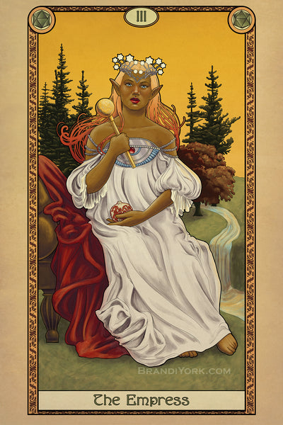 A tan skinned elf sitting on a plush chair in the middle of a grass field. Her white robes billow around her, one hand raised holding a scepter, her other hand cradling a cut pomegranate. Her bare foot touches the grass, while a river runs behind her, up through trees in the background. The whole piece is surrounded by a decorative border with the words "The Empress" at the bottom.