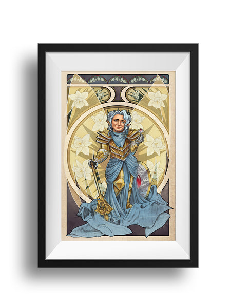 A black frame and white mat hold an Art nouveau styled print of Pike from Critical Role, standing golden plate with rubies, her mace in hand, her shield at her side. Her translucent golden wings at rest behind her, with the nouveau frame filled with daffodils behind her, which mean "rebirth."